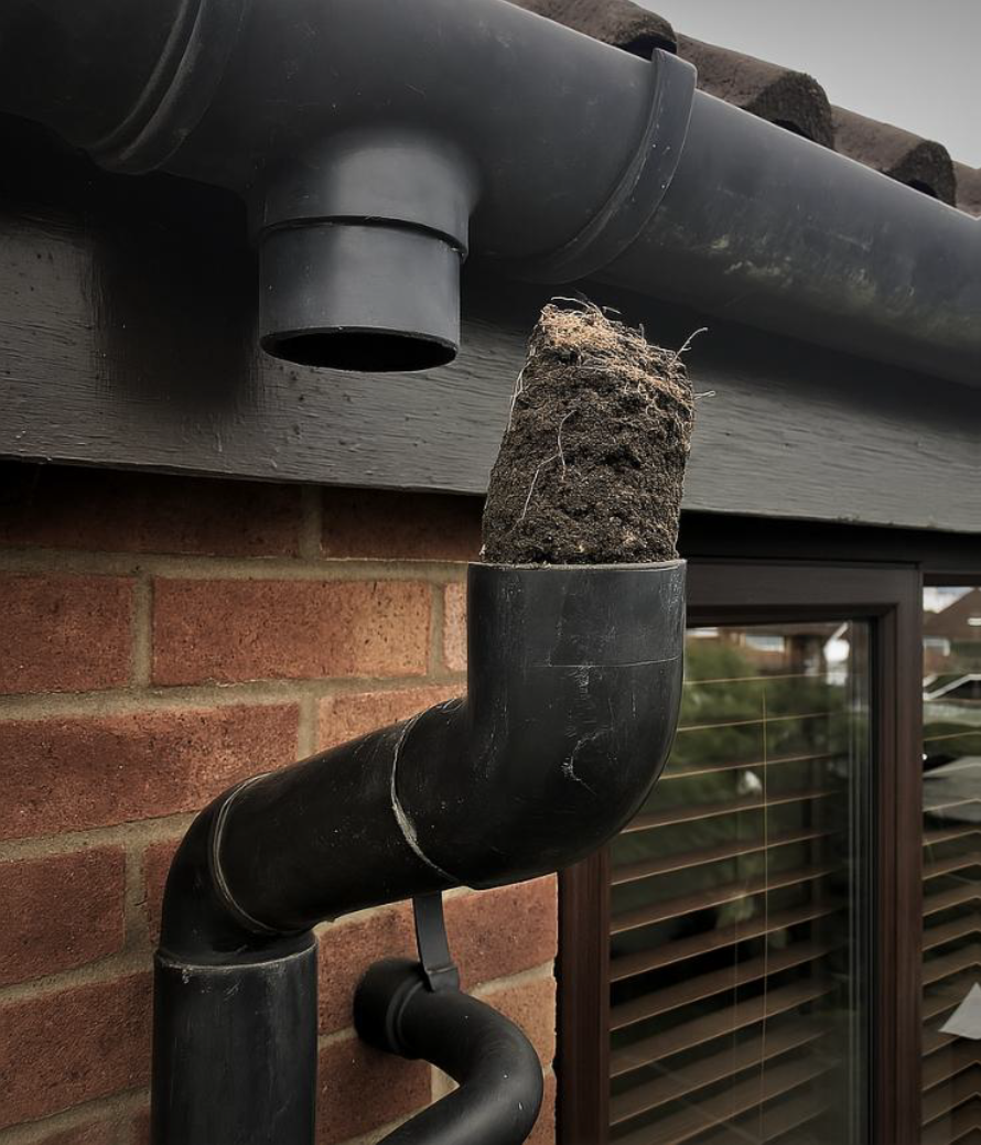 Downpipe blocked by debris
