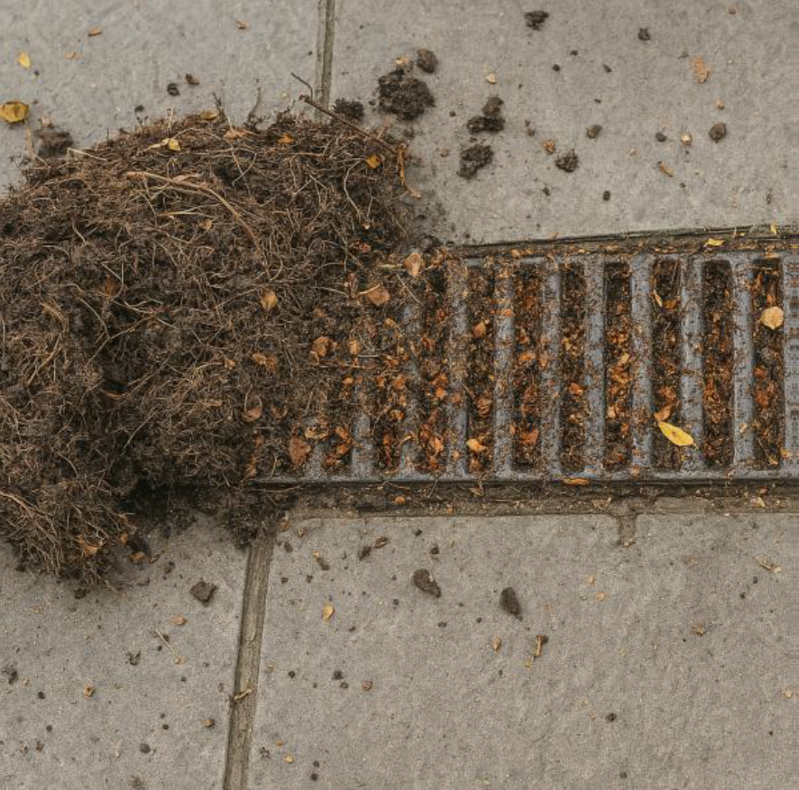 Blocked ground-level drainage channel